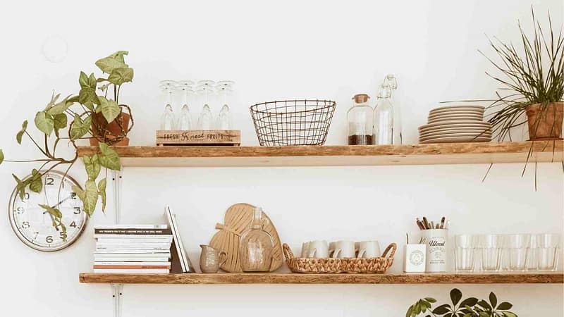 Dishes being displayed on kitchen shelves example